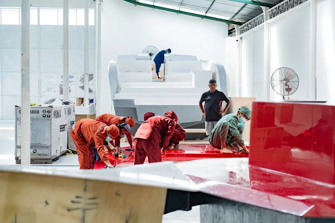 A hull under construction on the Fortune Yachts factory floor